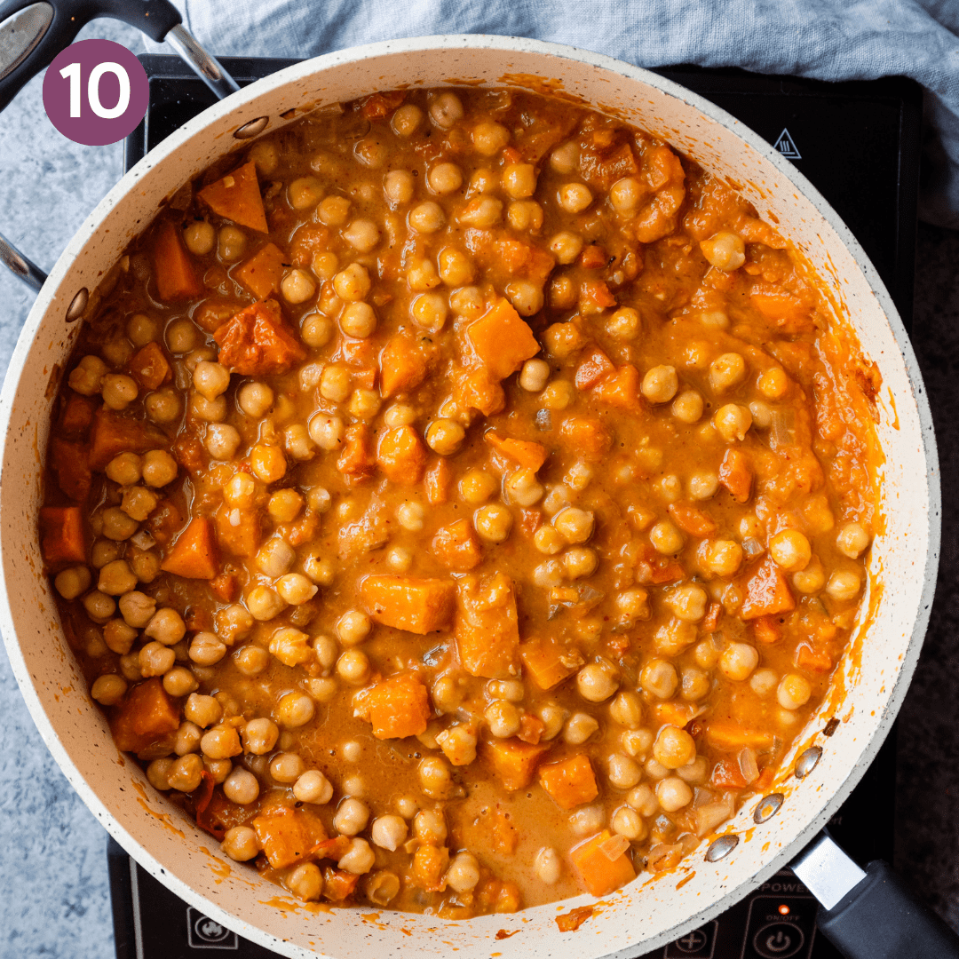 butternut squash curry with chickpeas in a saute pan. 