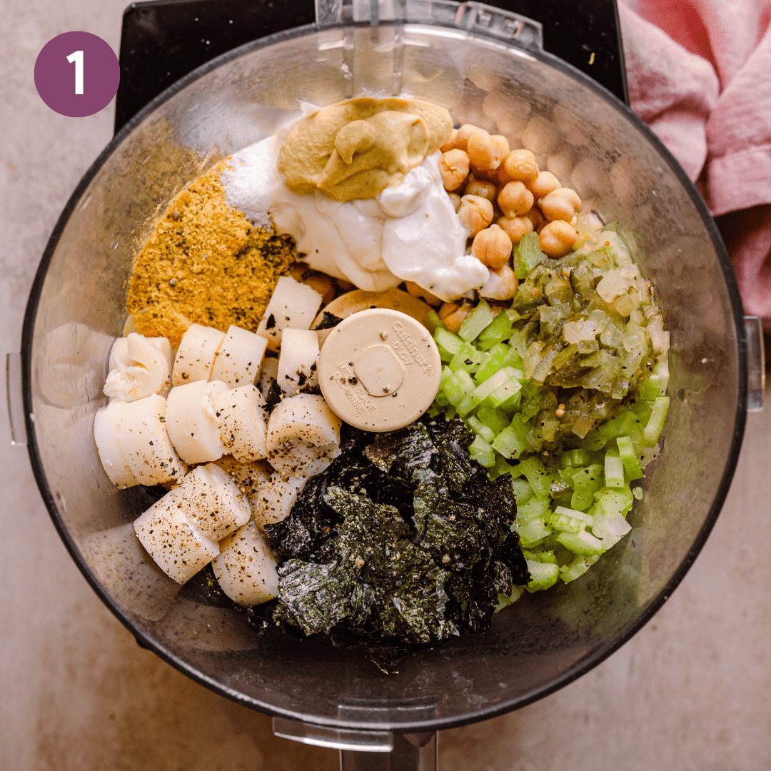 chickpeas, hearts of palm, nutritional yeast, nori, celery and vegan mayo in a food processor bowl.