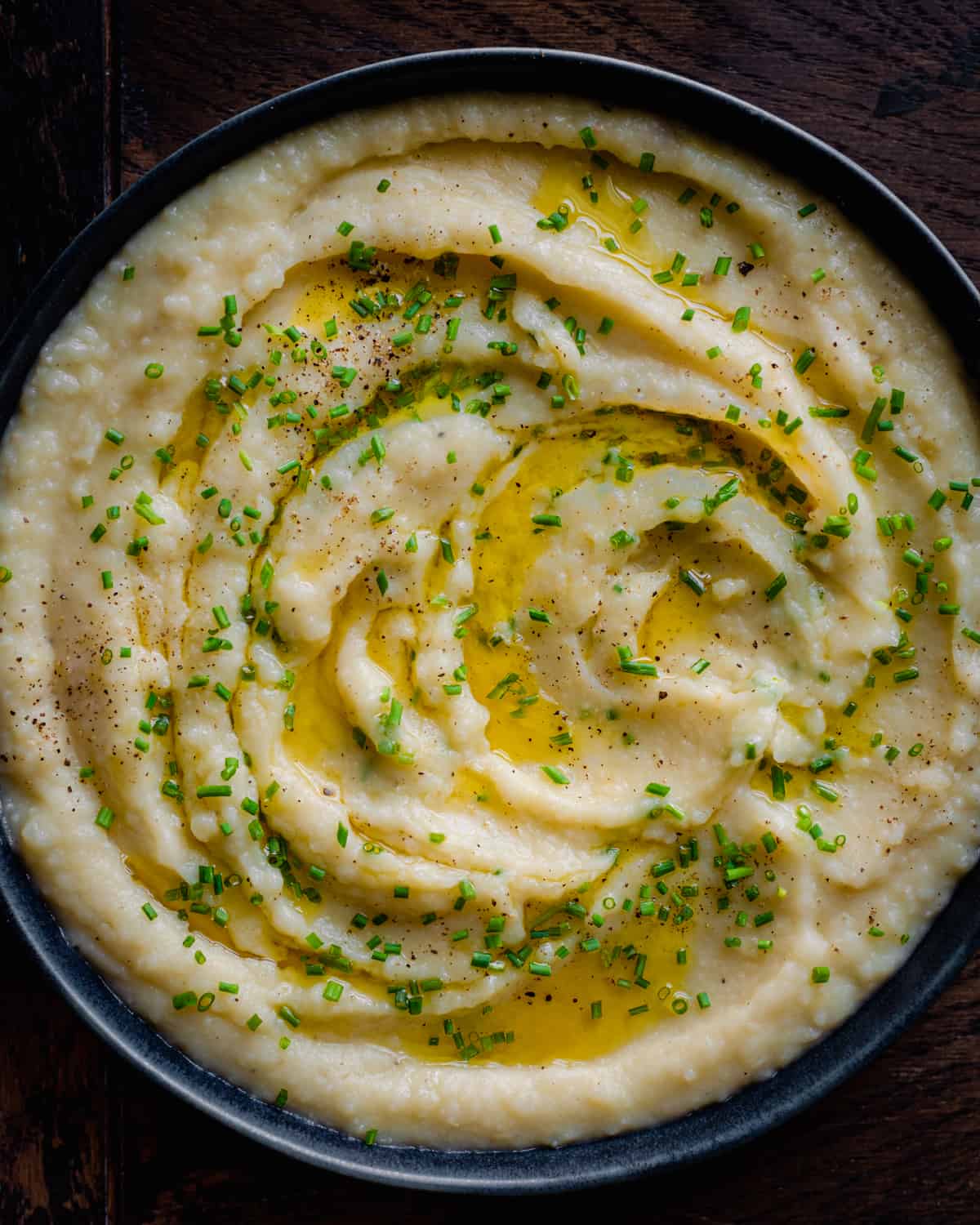 vegan mashed potatoes with butter and chives in a bowl