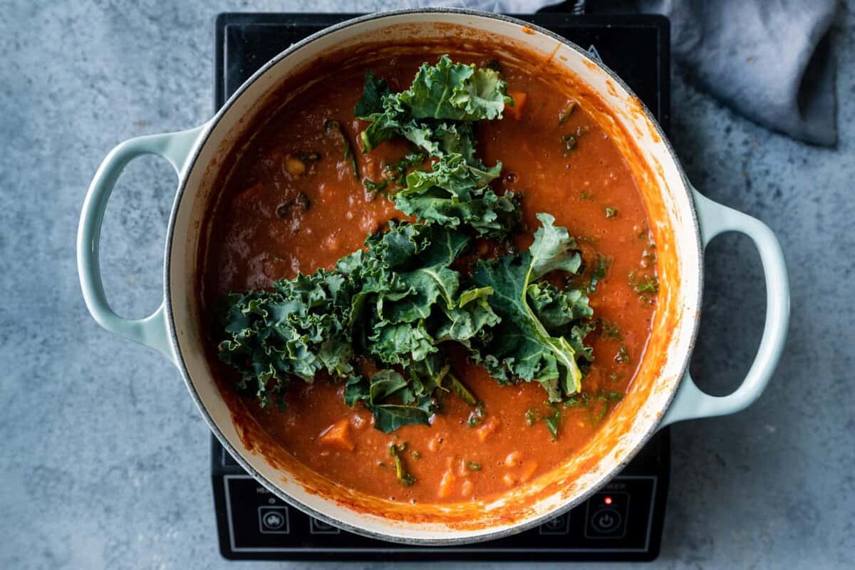 raw kale added to the stew.