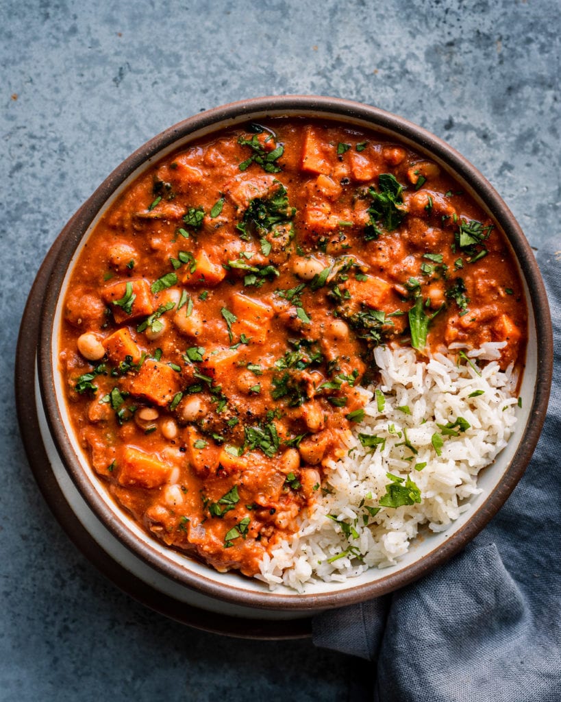 bowl of west african peanut stew garnished with cilantro and side of rice (1 of 1)