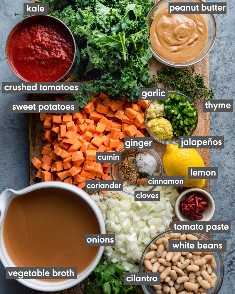 ingredients for west african peanut stew on a cutting board with ingredients written in text