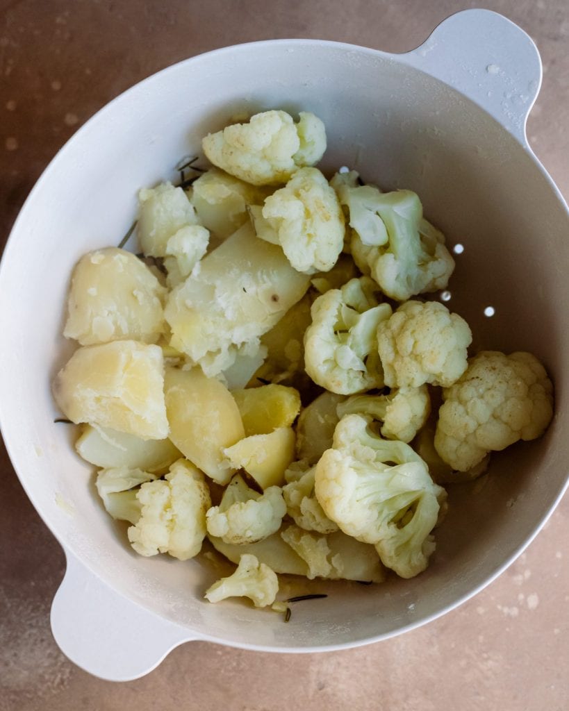 boiled potatoes and cauliflower in bowl