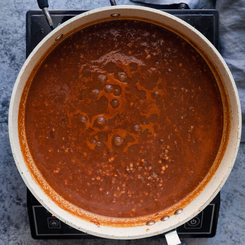 tomato lentil mixture simmering in saute pan