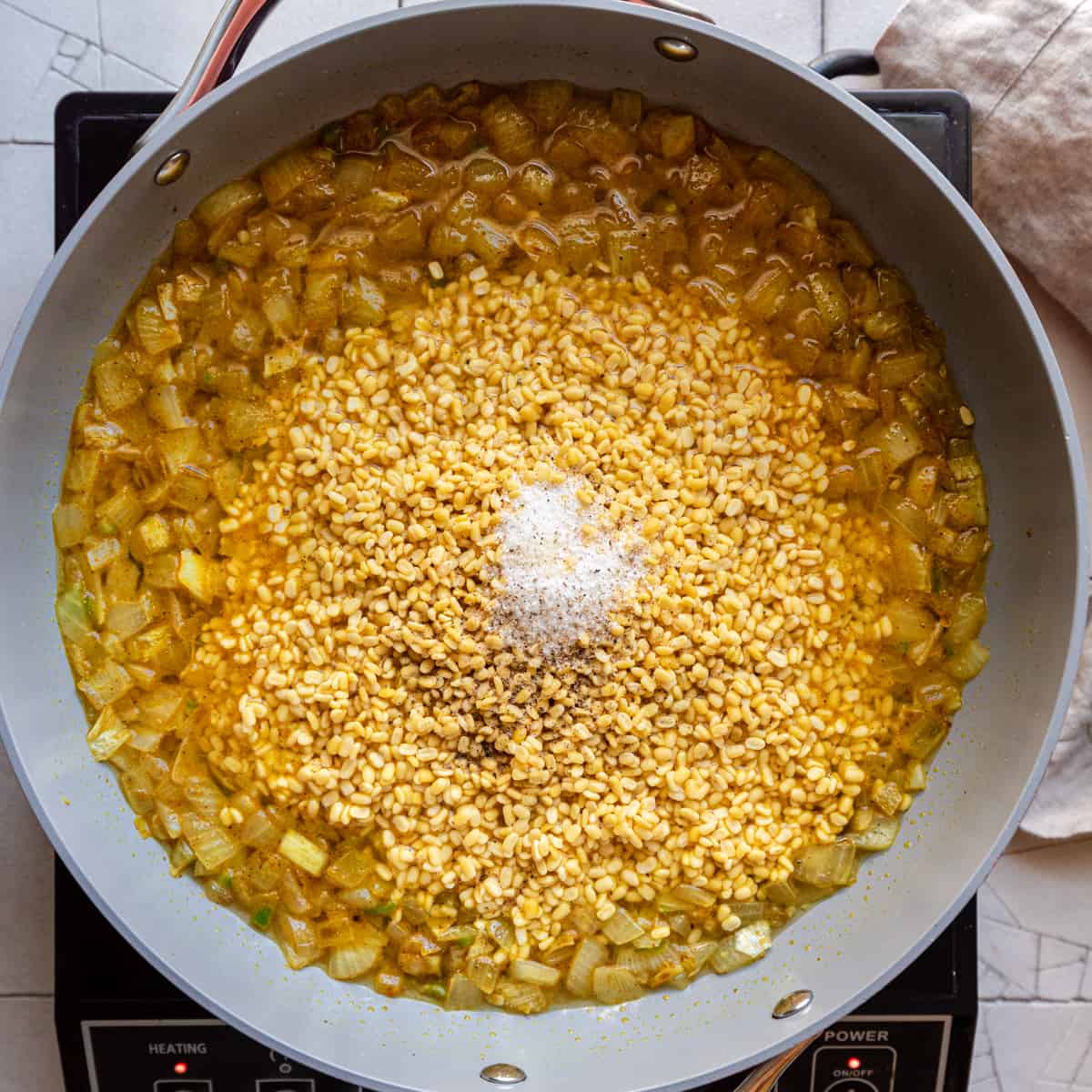 dal in frying pan with water and salt