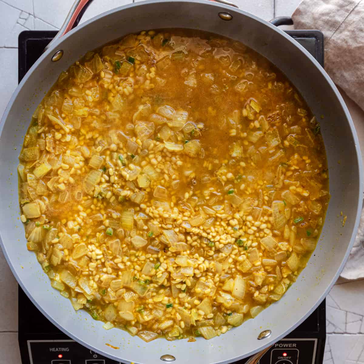 dal about to start simmering in frying pan