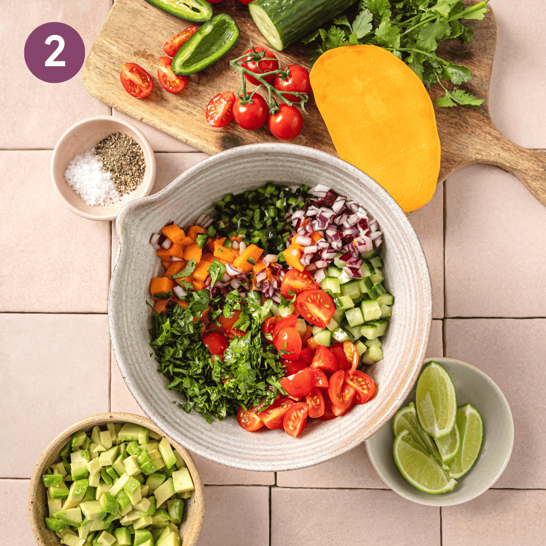 large bowl with mango salsa ingredients in it before being mixed together.