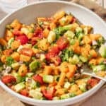 close up overhead view of mango avocado salsa in a large shallow bowl.
