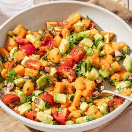 close up overhead view of mango avocado salsa in a large shallow bowl.