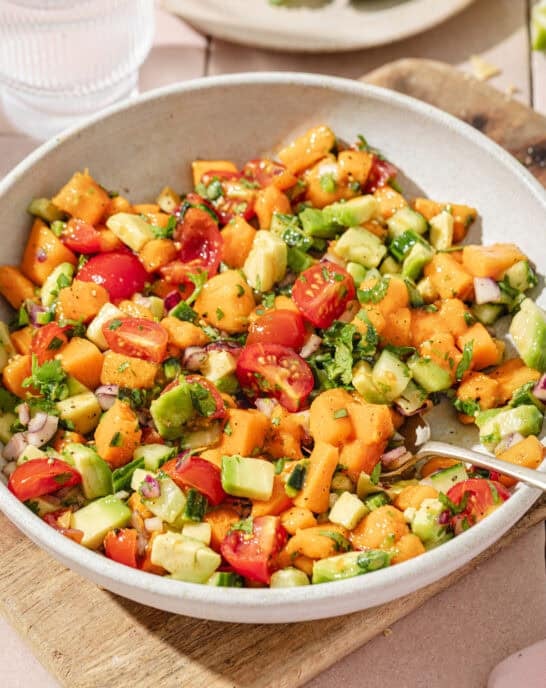 close up overhead view of mango avocado salsa in a large shallow bowl.