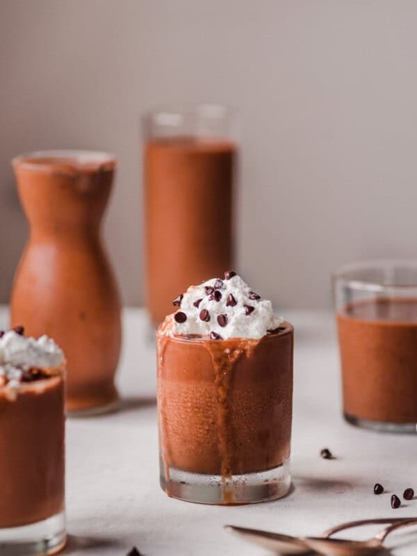 Sweet potato milkshake in 5 various glasses.