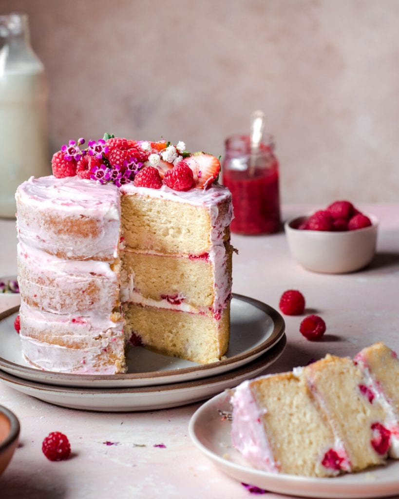 raspberry frosted naked vanilla layer cake