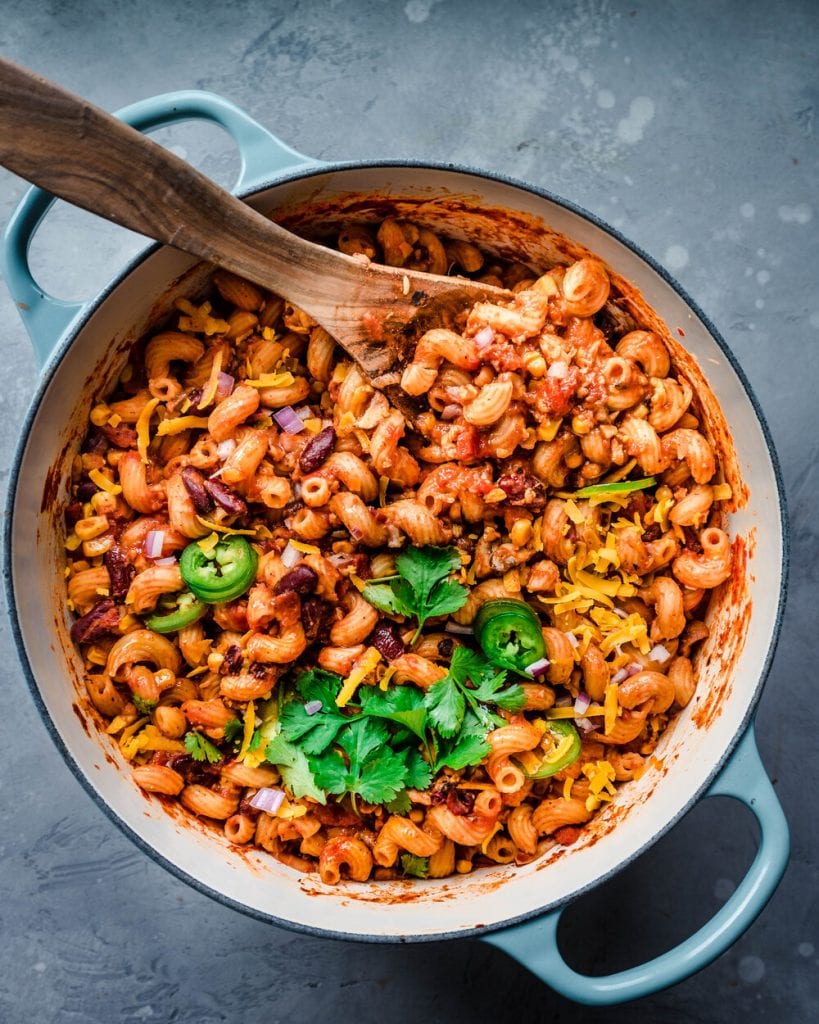 big saucepan of vegan chili mac with cilantro