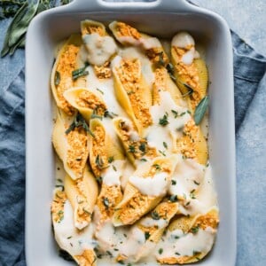 Casserole dish with ricotta stuffed shells inside