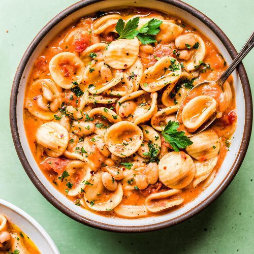 Italian white bean and pasta stew in a bowl.