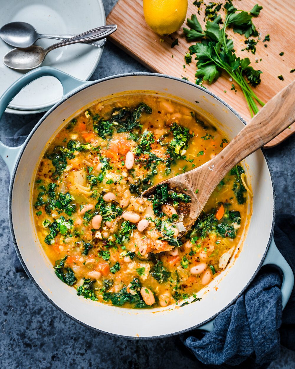 white bean soup with kale and gremolata in dutch oven