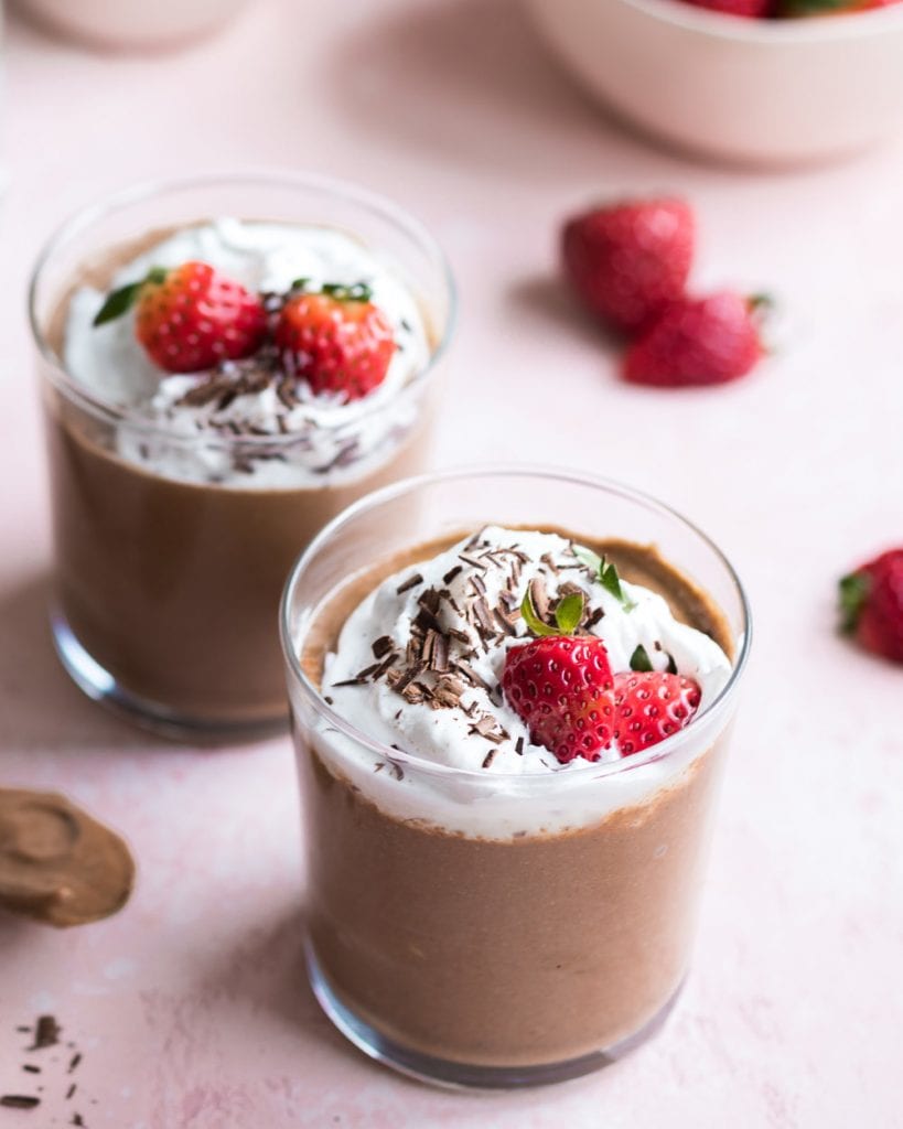 Healthy Chocolate Chia Mousse in glasses with whipped cream