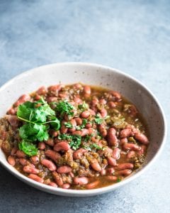 Mexican-spiced kidney beans or frijoles in a bowl with cilantro