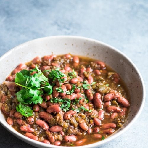 Mexican-spiced kidney beans or frijoles in a bowl with cilantro