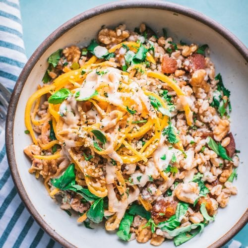 grain bowl with farro, butternut squash noodles, and fresh herbs