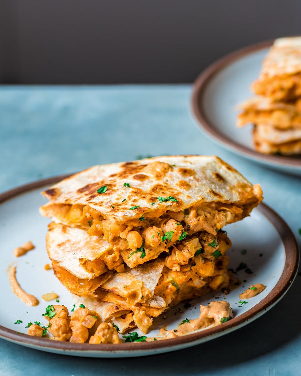 close up shot of vegan buffalo chickpea quesadillas on a plate