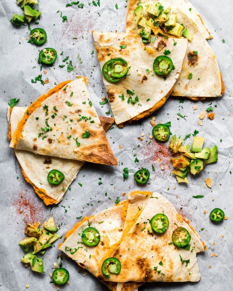 sweet potato quesadillas with jalapenos and avocado on butcher paper