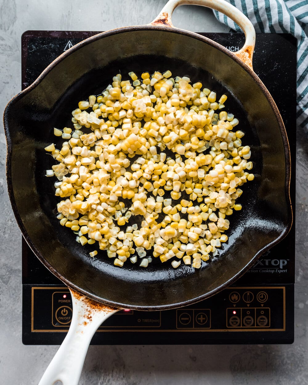 shaved corn in cast iron skillet.
