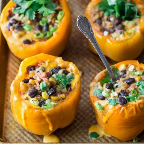 Instant Pot Burrito Bowl Stuffed Peppers on baking tray.