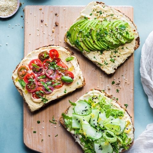 slices of toast with cheesy spread and veggies