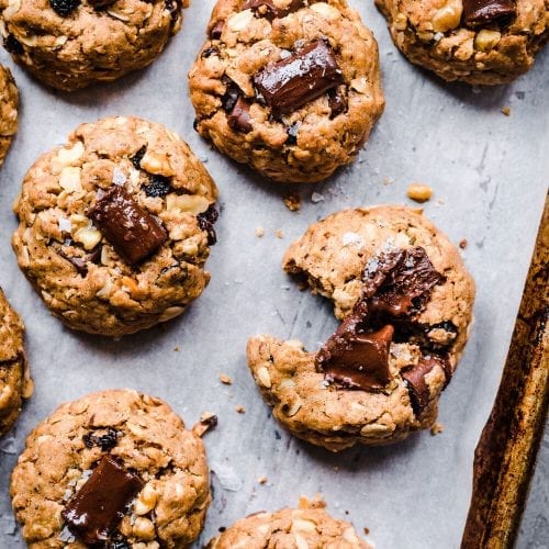 chocolate chunk vegan oatmeal cookies with one cookie bite