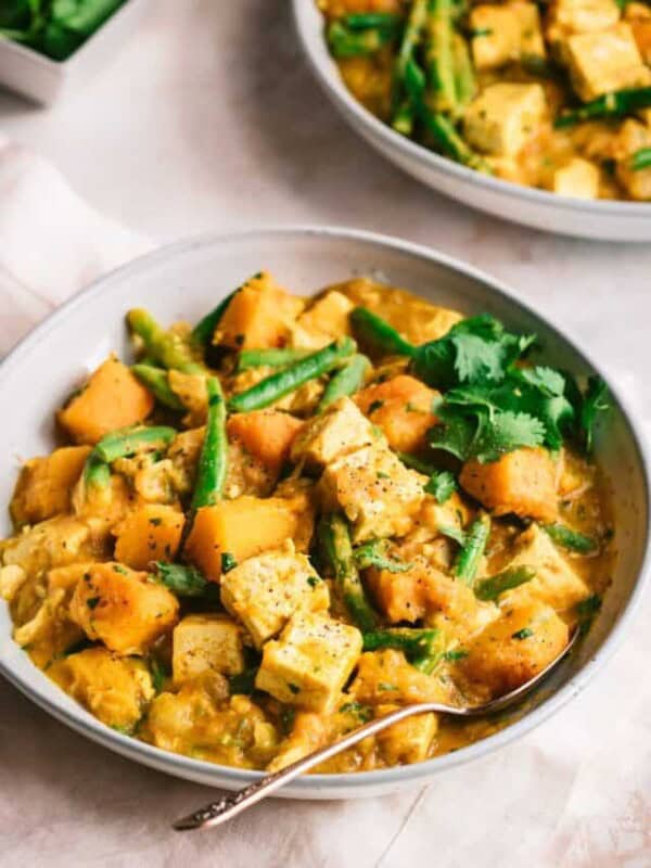 pumpkin curry with tofu in a bowl.
