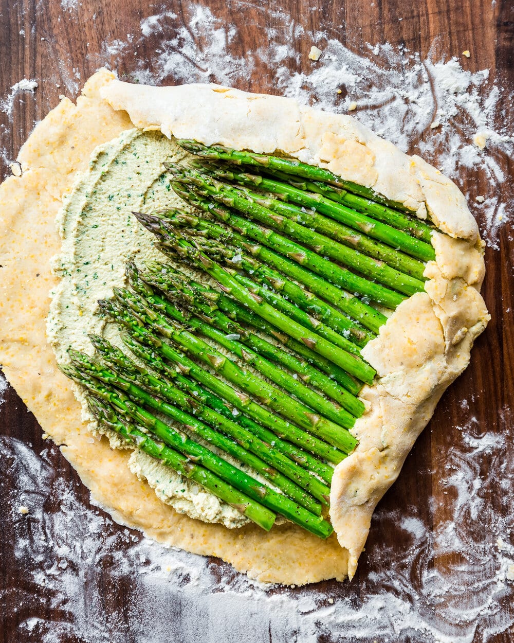 Dough completely covering two sides of the asparagus.