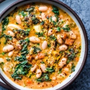 white bean soup with kale and gremolata in bowl