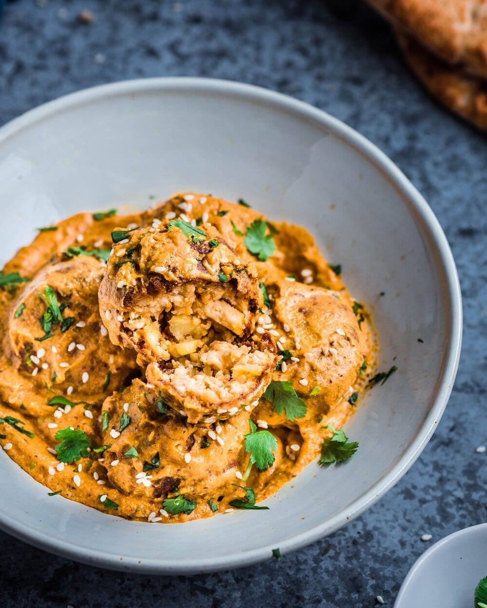 a bowl of restaurant-style vegan malai kofta.