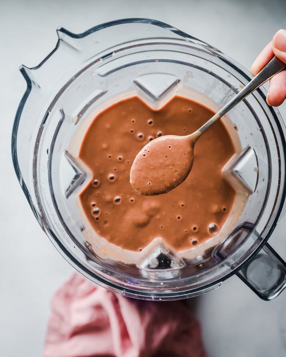 blended chocolate milkshake with spoon