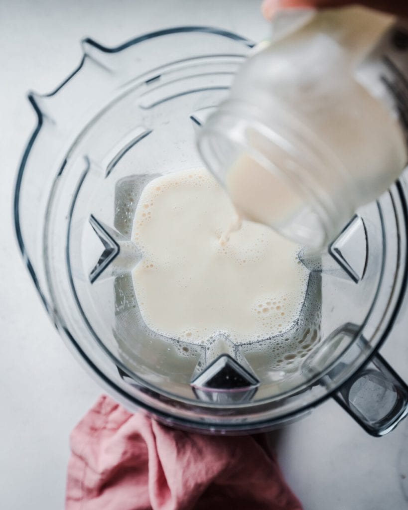 plant milk being added to blender