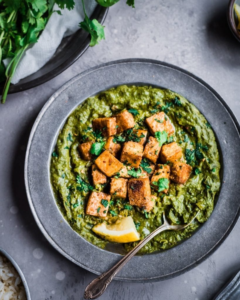 vegan palak paneer with crispy baked tofu on top