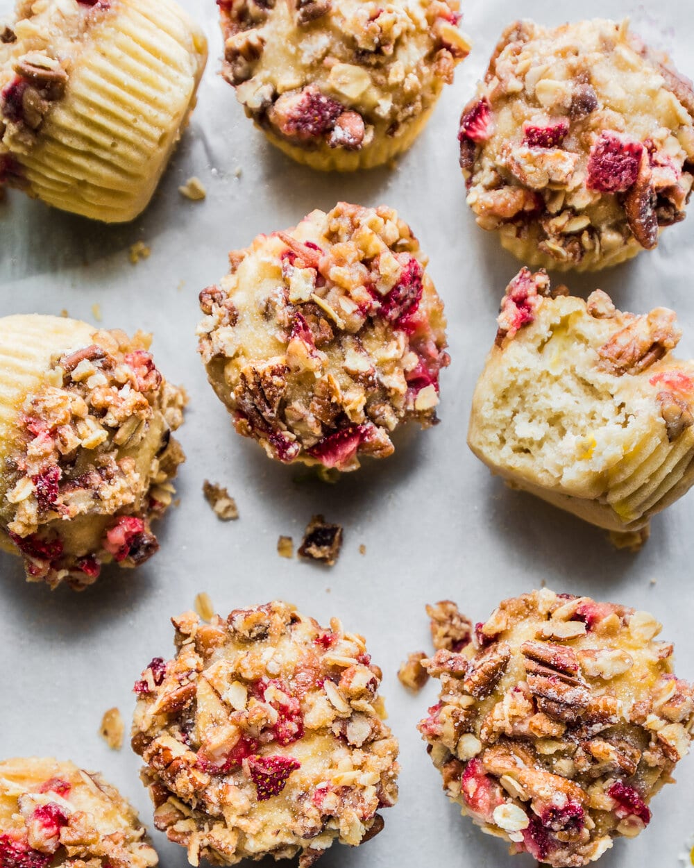 Overhead photo of finished muffins on a sheet of parchment paper.