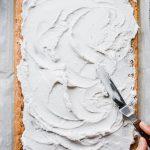 Vegan Strawberries and Cream Sheet Cake. Frosting cake with coconut whipped cream.