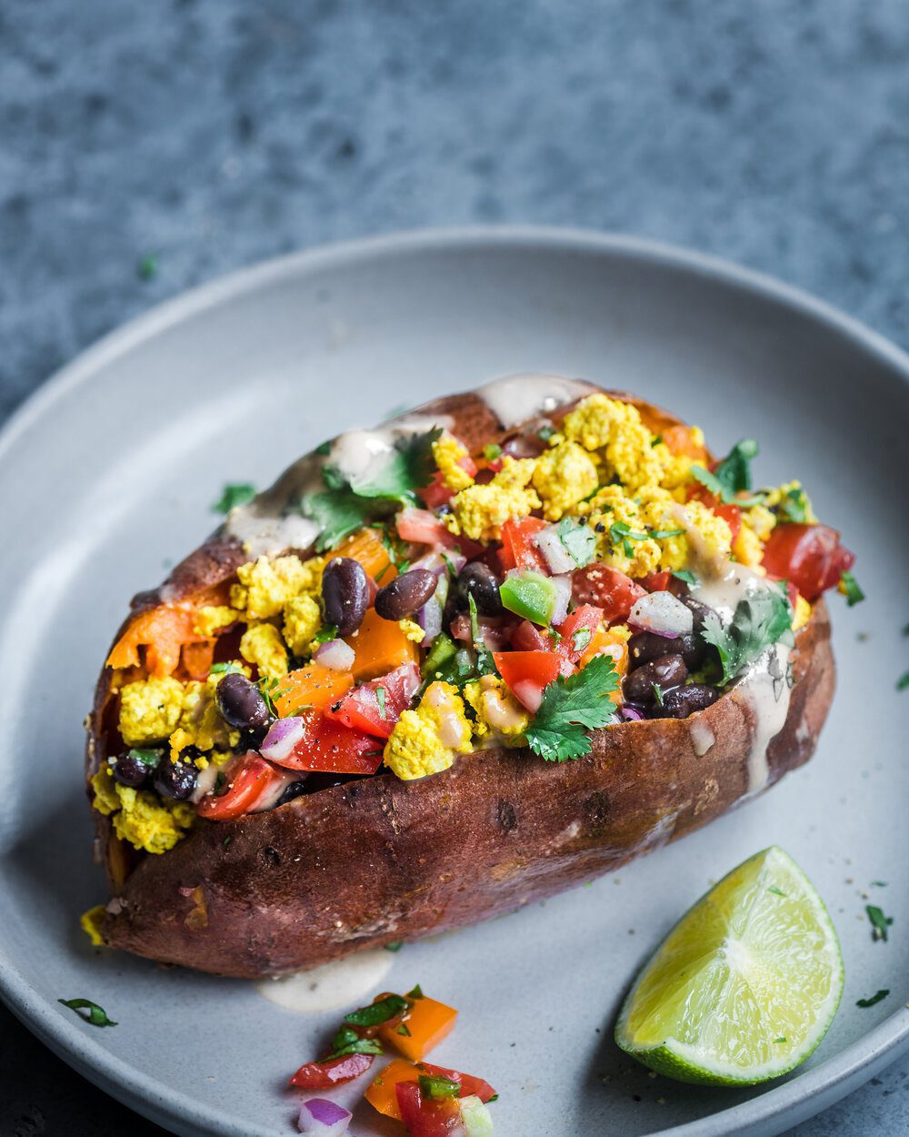 10 Easy Vegan Breakfast Ideas. Tofu Scramble Stuffed Sweet Potato.