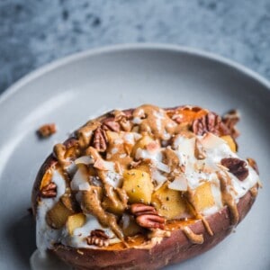 sweet potato stuffed with coconut yogurt, almond butter, and sauteed apples