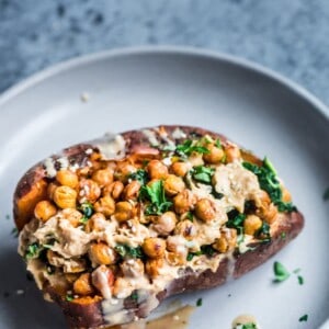 chickpea, kale and hummus stuffed sweet potato