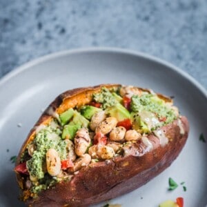 baked sweet potato stuffed with pesto and white beans