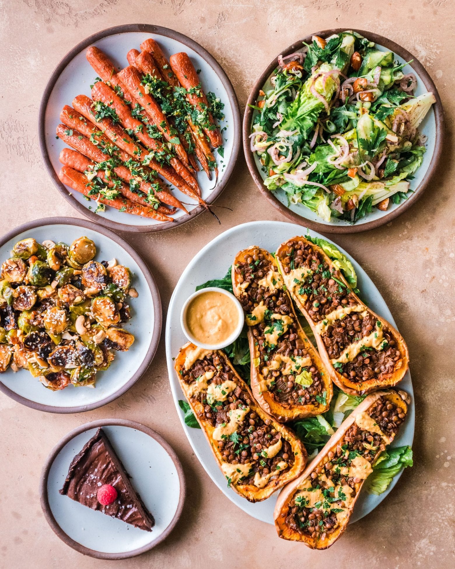 spread of various vegan thanksgiving plates on a table.