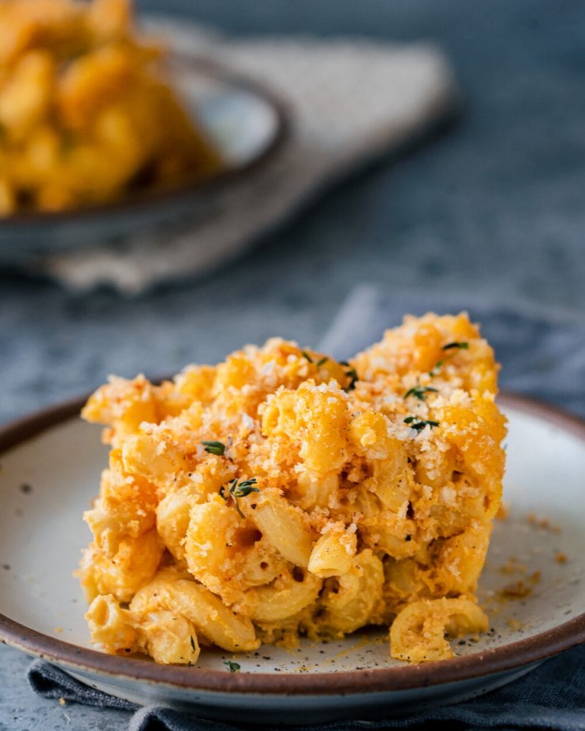 sliced of crispy baked vegan mac and cheese on plate