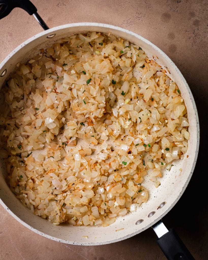 cooked onion, garlic, rosemary and sage in saute pan