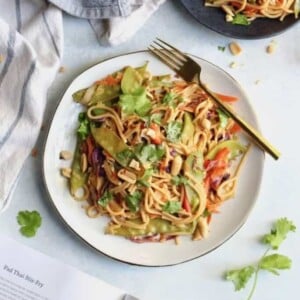 pad thai on white plate with fork