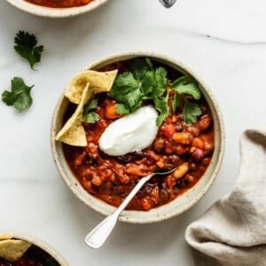 bowl of vegan chili with tortilla chips