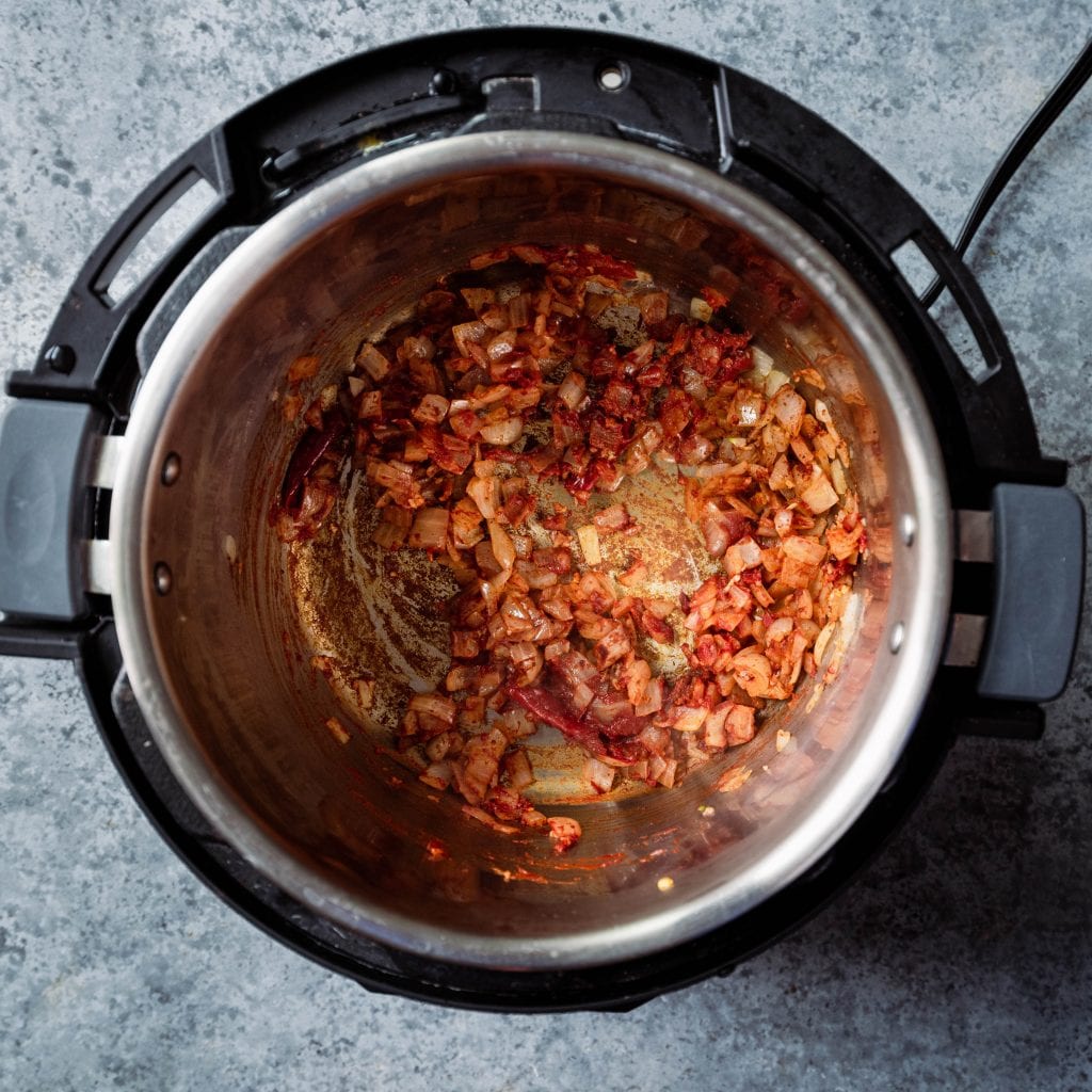 stir tomato paste and spices into onions in the instant pot
