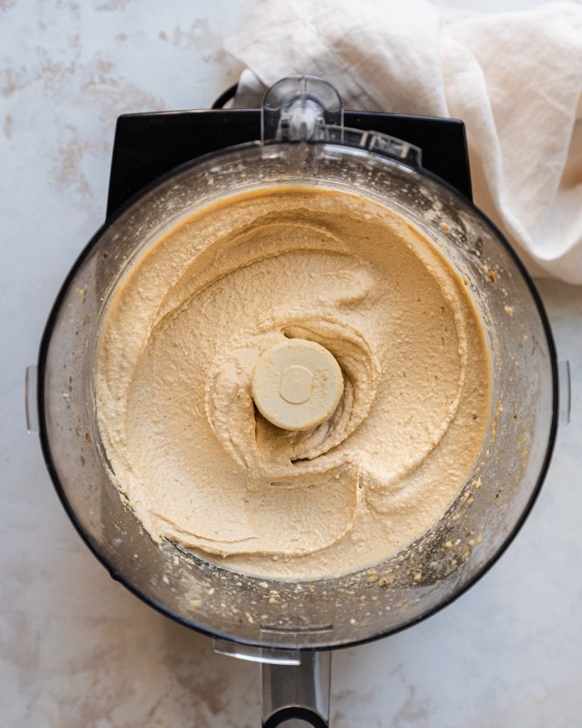 blended smooth hummus in food processor